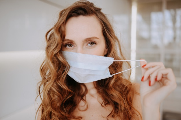 close-up-portrait-beautiful-young-european-woman-wearing-protective-mask-corona-virus-prevention-hygiene-stop-spreading-coronavirus-avoid-contaminating-corona-virus-covid-19-concept_124463-933